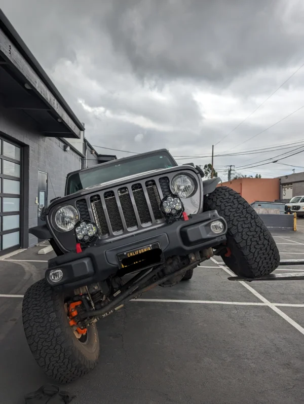 A jeep that has been lifted off the ground.