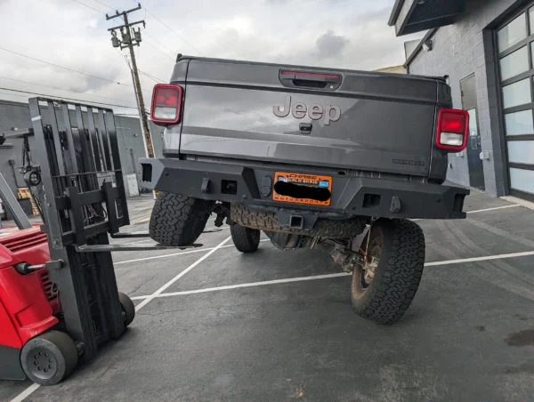 A truck is parked in the parking lot.